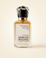 A bottle of Aangan Intense, a luxurious unisex oriental perfume with rich notes of oud and leather.