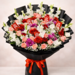 KitKat chocolate bouquet Lahore featuring fresh flowers and red ribbon.