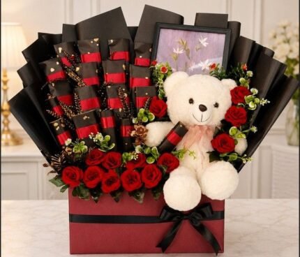 A luxury hamper with a teddy bear, roses, and chocolates, ideal for gift delivery in Lahore.
