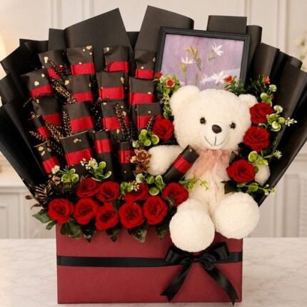 A luxury hamper with a teddy bear, roses, and chocolates, ideal for gift delivery in Lahore.