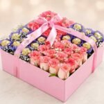 A luxurious gift box featuring pink roses and chocolates for Rose and chocolate delivery Lahore.