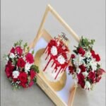 A premium anniversary cake and floral crate for anniversary gift delivery Lahore.