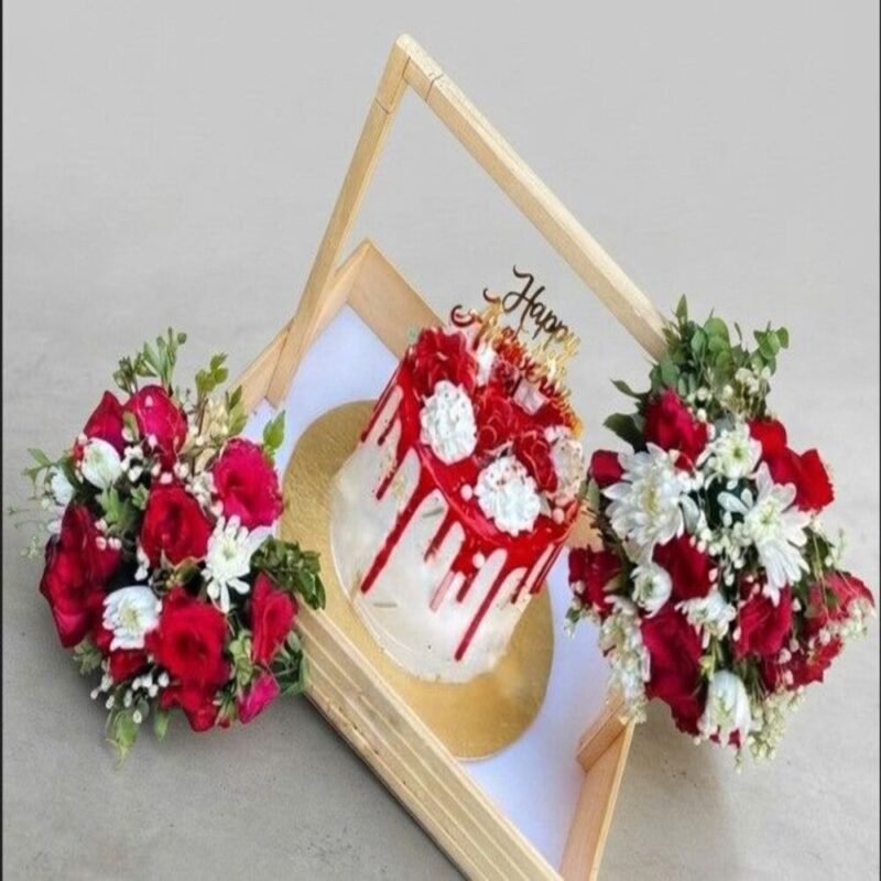 A premium anniversary cake and floral crate for anniversary gift delivery Lahore.