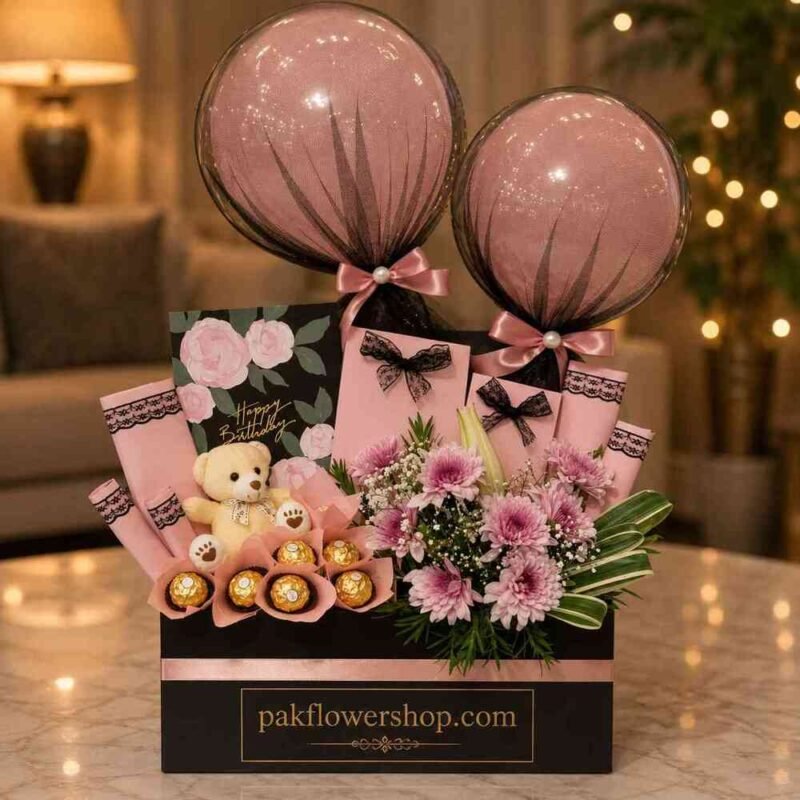 A festive birthday gift set with a teddy bear and flowers for gift delivery Lahore.