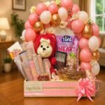 Birthday hamper delivery Lahore featuring chocolates, balloons, and a teddy bear.