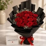 Red roses in black wrapping birthday gift delivery Lahore