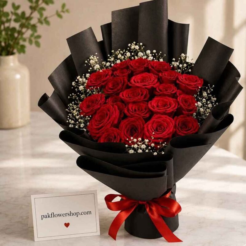 Red roses in black wrapping birthday gift delivery Lahore
