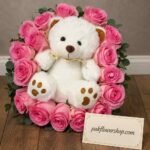 Plush teddy bear and pink rose arrangement from our online gift delivery Lahore service.