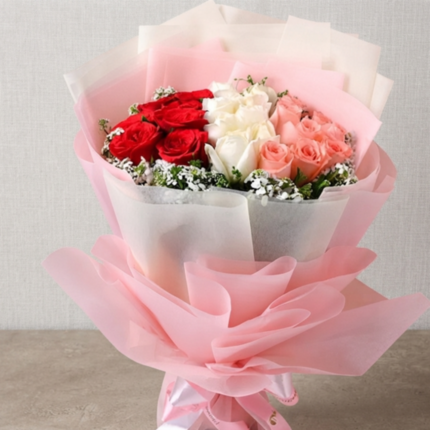 A premium tri-color rose arrangement from the best flower shop Lahore.