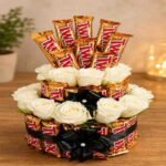 A beautiful Twix chocolate and white rose arrangement for online gift delivery.