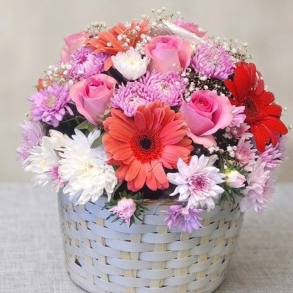 Vibrant-Floral-Gift-Basket A beautiful floral basket arrangement, provided by the best florist in Lahore.