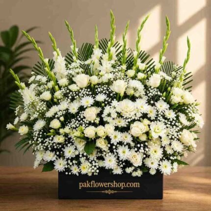 Elegant white sympathy floral arrangement for funeral flowers delivery Lahore