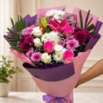 Birthday flower delivery Pakistan with pink lilies and purple chrysanthemums.