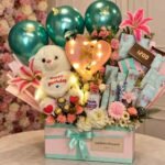 birthday gift hamper Lahore with flowers, teddy bear, chocolates, and balloons