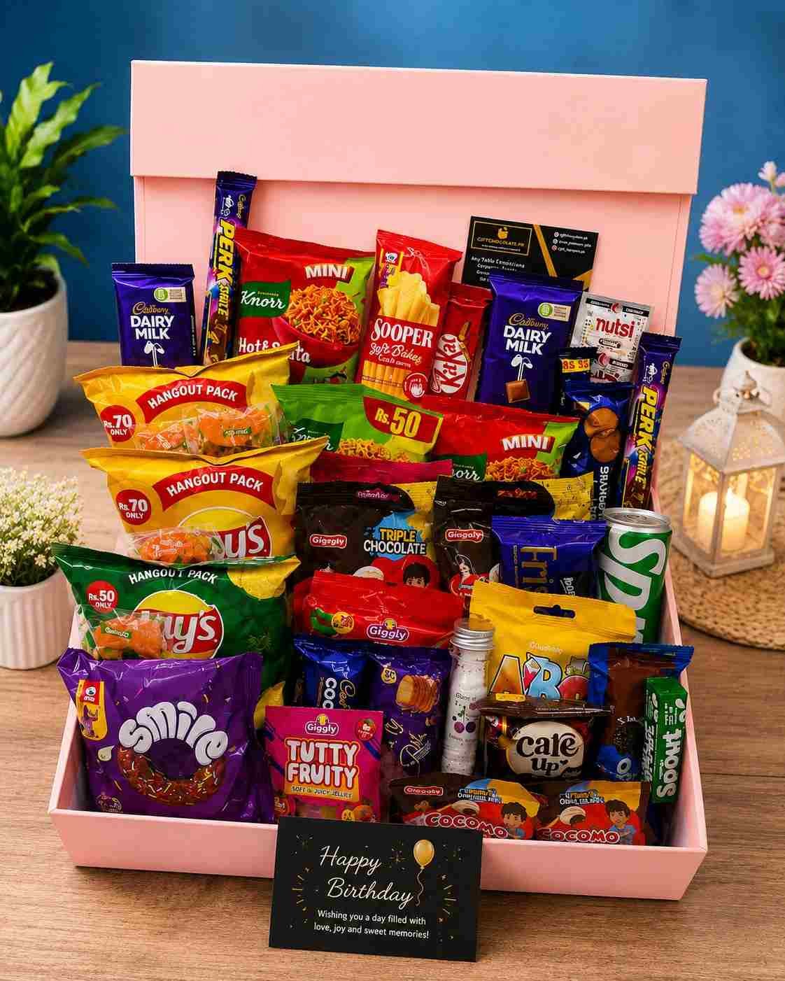 Birthday Gift Box Pakistan Birthday Gift Box Pakistan filled with chocolates, snacks, biscuits, noodles, and drinks.
