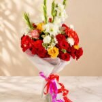 Mixed flower bouquet Lahore with red roses and white gladiolus.