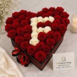 Luxury Rose Box Pakistan with fresh red and white roses in a heart-shaped box