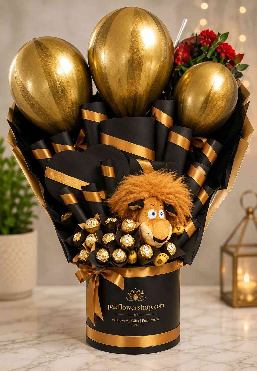 Luxury Gift Box Elegant gift box Pakistan with premium chocolates, metallic balloons, plush toy, and decorative floral accents.