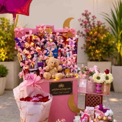 Elegant premium gifts Pakistan featuring flowers, chocolates, balloons, cake, plush toy, and luxury gift arrangements.