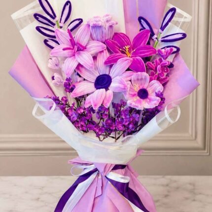 Lahore flower bouquet with purple and pink fresh flowers in elegant gift wrapping.