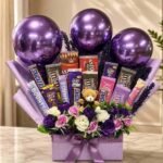 Chocolate gift bouquet Lahore with assorted chocolates, flowers, balloons, and teddy bear