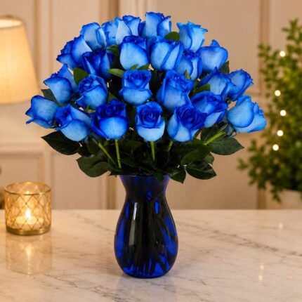 blue rose arrangement in cobalt glass vase