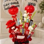 Anniversary Gift Box Pakistan with red roses chocolates teddy bear and balloons