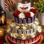 Premium chocolate hamper Pakistan with assorted chocolates, fresh roses, white flowers, and elegant tiered arrangement.