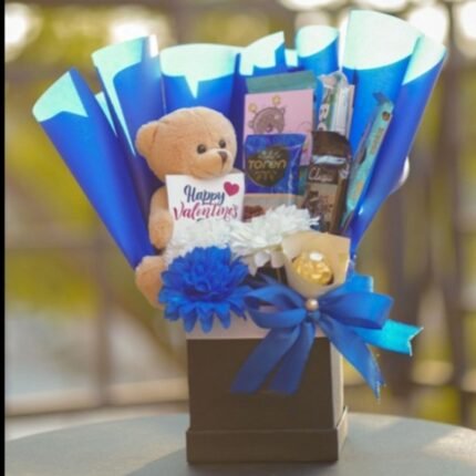 Premium gift basket Pakistan with chocolates, flowers, teddy bear, and elegant decorative packaging.