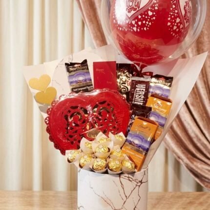 Heart chocolate balloon bucket arrangement to send gifts to pakistan