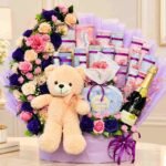 Gift Hamper Lahore with flowers teddy bear chocolates and sparkling bottle