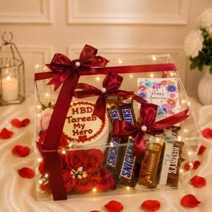 Clear acrylic box with fresh red roses and chocolates for birthday gift delivery Lahore
