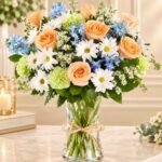 Fresh flower bouquet Lahore with peach roses, white daisies, and blue flowers