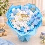 Baby gifts Lahore featuring a blue newborn bouquet with baby essentials