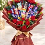 Chocolate Bouquet Lahore with assorted chocolates and red flowers