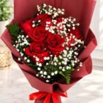 Red rose bouquet Pakistan with baby’s breath and fresh greenery