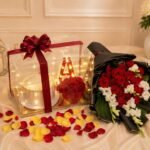 Rose Cake Combo Lahore with red roses, cake, and glowing initial