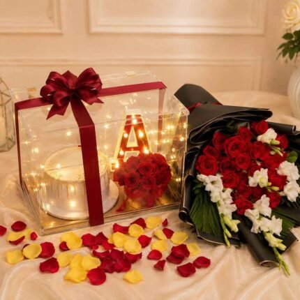 Rose Cake Combo Lahore with red roses, cake, and glowing initial