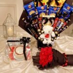 Large snack bouquet, teddy bear, and cake box arranged for corporate gift delivery in Lahore
