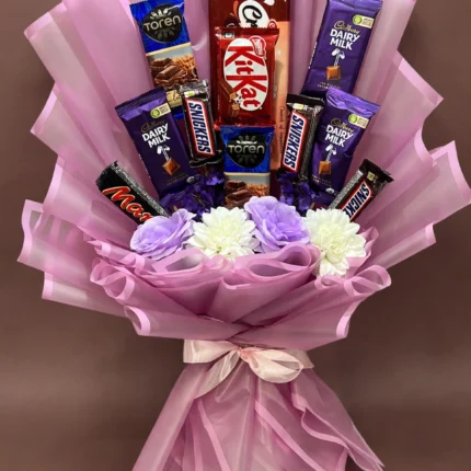 Chocolate bar bouquet with assorted chocolate bars in pink wrapping