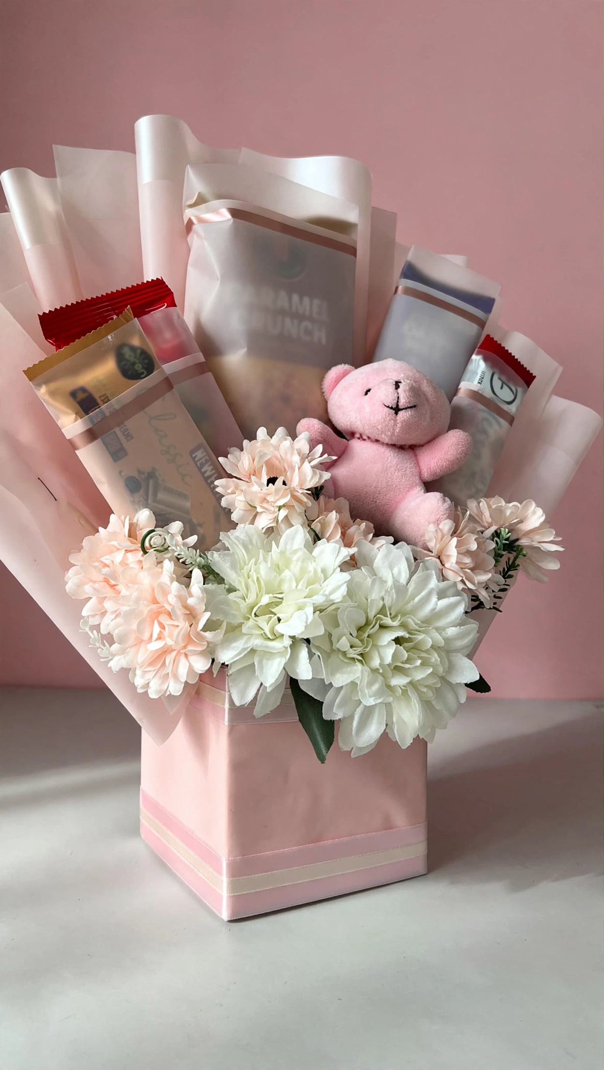 Blush chrysanthemum snack gift bag at a three-quarter angle